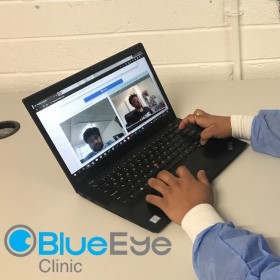 A laptop with an active BlueEye Clinic video call